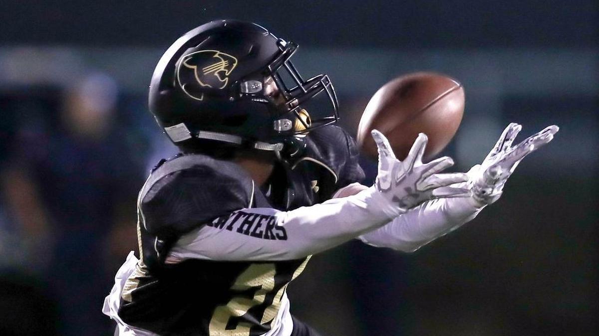 Keller Fossil Ridge defensive back Cole Crawford comes up with an interception against Haltom.