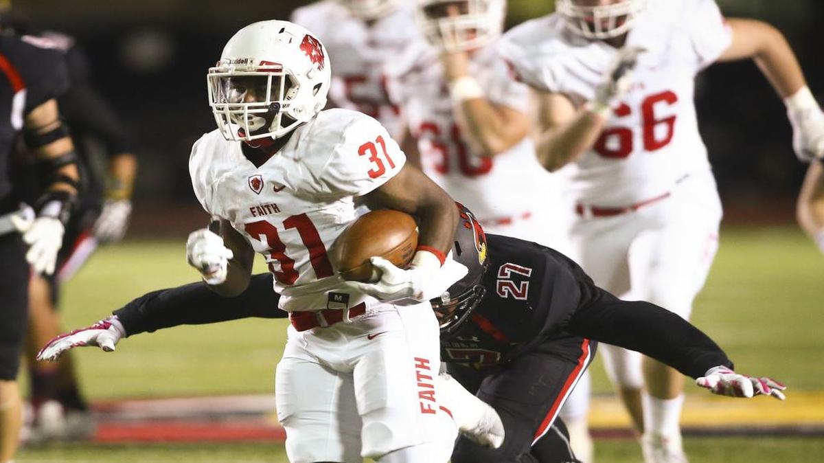 Grapevine Faith Keyshawn Wyatt (31) on a touchdown run as Fort Worth Christian Jay Marshall (27) tries for the tackle in a high school football game Friday, October 21, 2016.