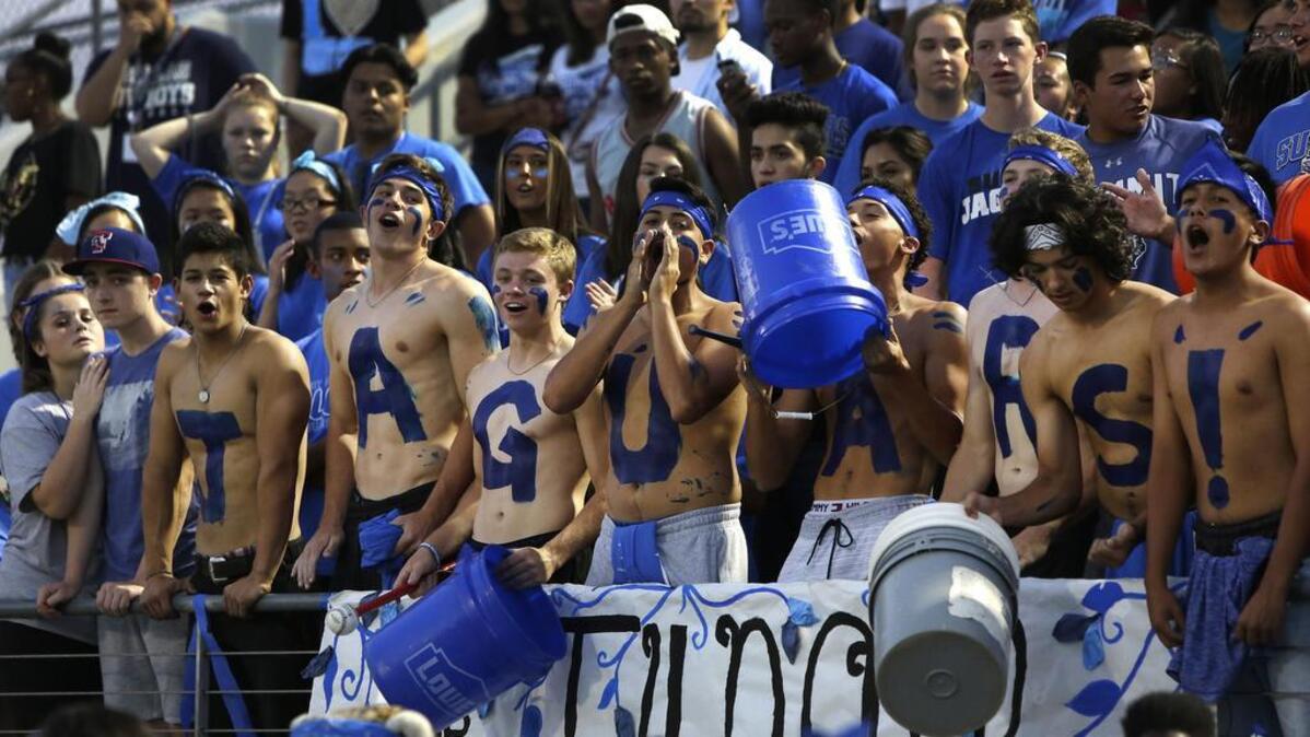 Mansfield Summit Jaguars fans cheer their team in September.