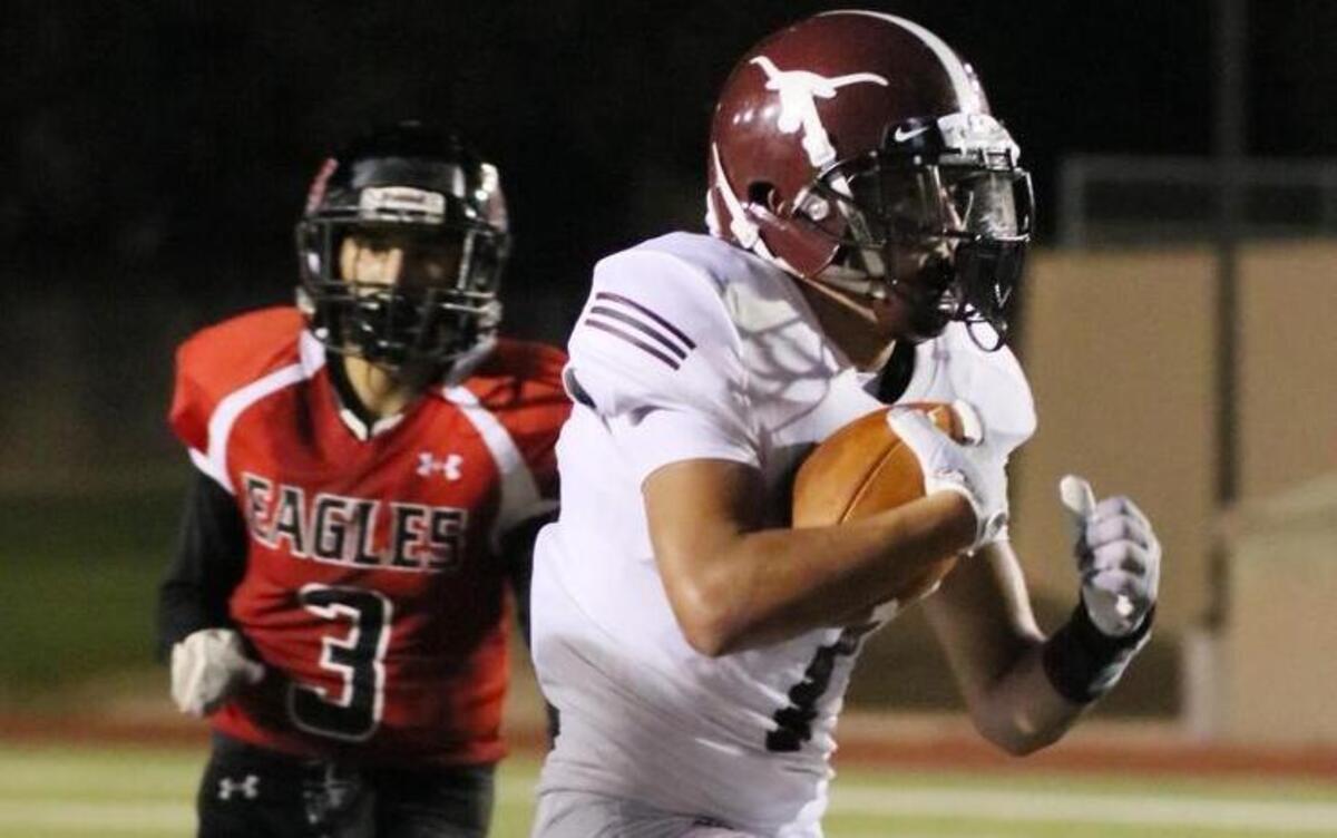 North Side’s Erick Esparza rushes by Diamond Hill-Jarvis’ Jose Robles for a second-quarter touchdown Friday.