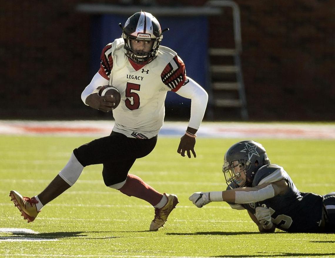 Mansfield Legacy’s Jalen Catalon (5) eludes Frisco Lone Star’s Jaylan Ford (45) during a Class 5A state quarterfinal playoff game at Gerald J. Ford Stadium in Dallas, Dec. 9, 2017.