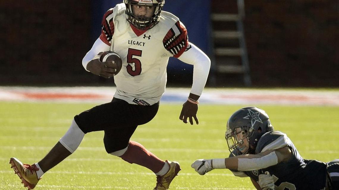 Mansfield Legacy’s Jalen Catalon (5) eludes Frisco Lone Star’s Jaylan Ford (45) during a Class 5A state quarterfinal playoff game at Gerald J. Ford Stadium in Dallas, Dec. 9, 2017.