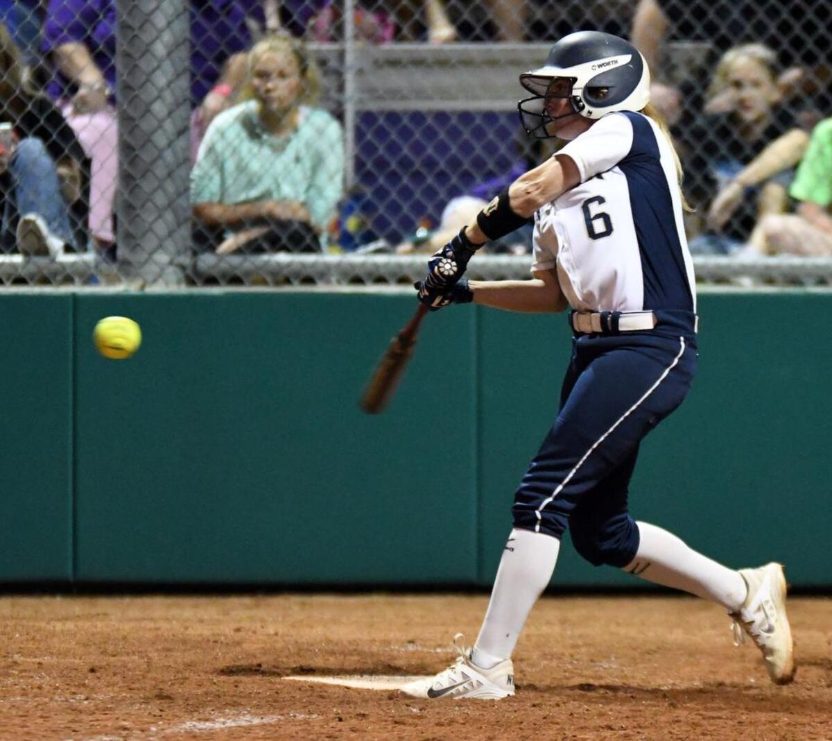 Keller's Kasey Simpson hits an RBI single to take a 3-1 lead over Timber Creek during the third inning of Friday's May 27, 2016 softball Region I championship playoff game at Chisholm Trail High School.