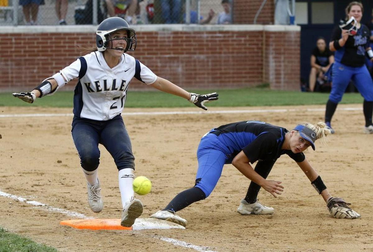 Keller left fielder Caraline Woodall (21) signals safe at first as Plano West first baseman Mikaela Gilliam (1) looses the ball as Keller played Plano West in a 2017 6A Region I Regional Final softball game at Flower Mound High School, May 26, 2017.
