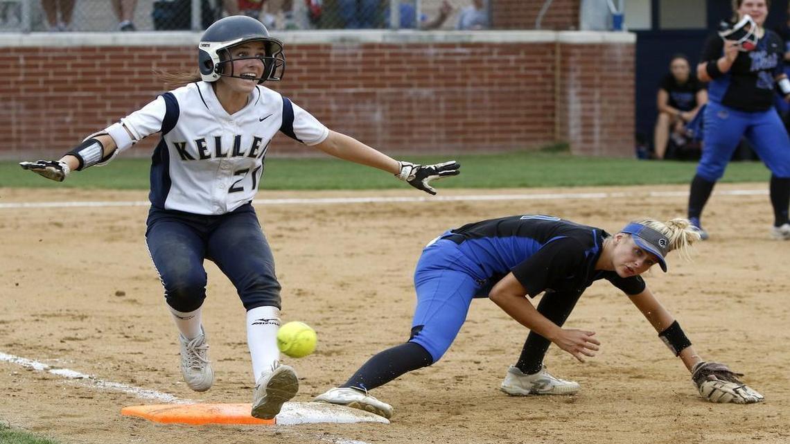 Keller left fielder Caraline Woodall (21) signals safe at first as Plano West first baseman Mikaela Gilliam (1) looses the ball as Keller played Plano West in a 2017 6A Region I Regional Final softball game at Flower Mound High School, May 26, 2017.
