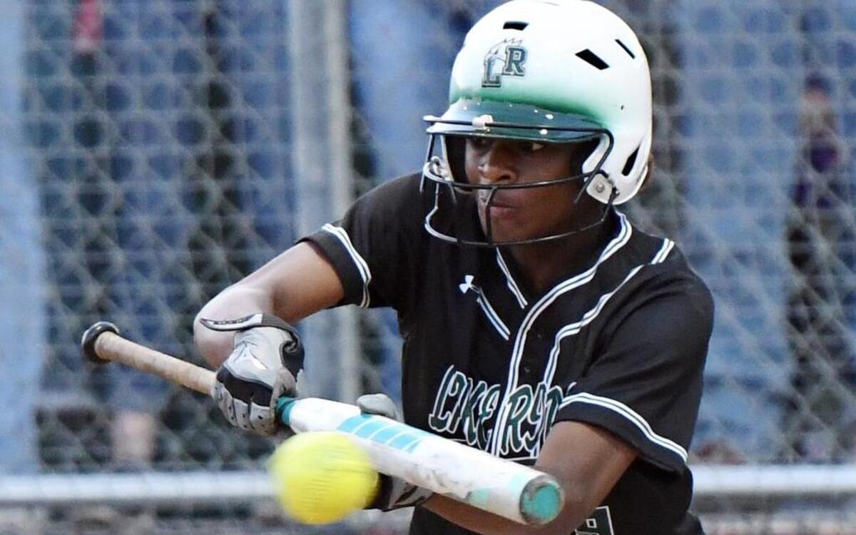 Lake Ridge outfielder Brittni Rufus connects for a bunt single against Granbury during the fifth inning in Thursday’s April 27, 2017 playoff softball game in Weatherford, Texas. Lake Ridge went on to win 5-2.
