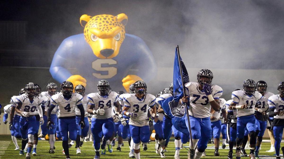 The Mansfield Summit football team runs onto the field before a playoff game against Dallas Kimball at Midlothian ISD Multi-Purpose Stadium Thursday, November 12, 2015.