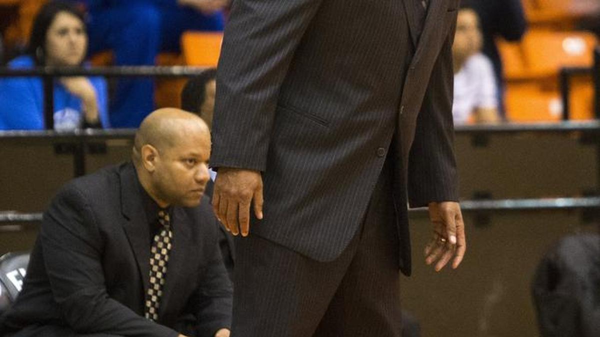 Dunbar head coach Robert Hughes Jr. commands the Wildcats during a bi-district playoff game with Brewer on Feb. 23, 2016, at the Wilkerson-Greines Athletic Center in Fort Worth.
