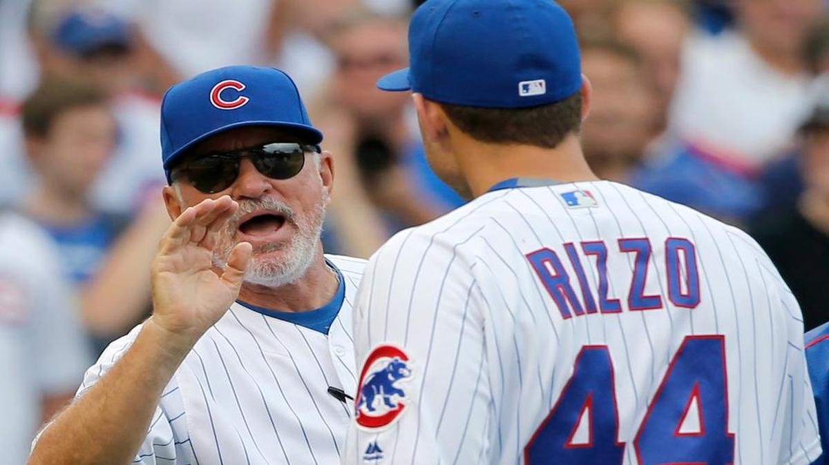 Chicago Cubs manager Joe Maddon, left, and Anthony Rizzo celebrate the Cubs’ 5-0 shutout of the St. Louis Cardinals on Friday. The Cubs and Cardinals play at noon Saturday on Fox (KDFW/Channel 4). The Cardinals are looking to stay in the wild-card race.