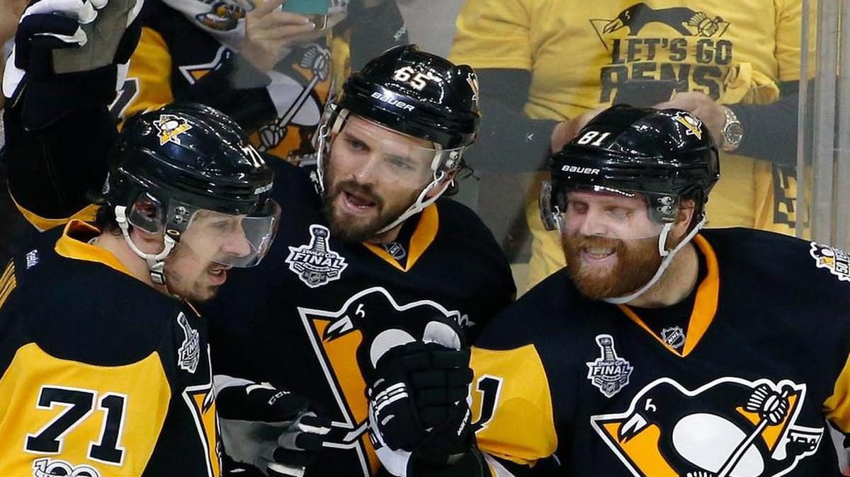 Pittsburgh Penguins player Ron Hainsey, center, celebrates his goal against the Nashville Predators with Evgeni Malkin, left, and Phil Kessel, right, during the second period in Game 5 of the Stanley Cup Final, Thursday, June 8, 2017, in Pittsburgh. The Penguins have their first chance to win the NHL title at 7 p.m. Sunday on NBC (KXAS/Channel 5) in Game 6 in Nashville. The Penguins routed the Predators 6-0 on Thursday to take a 3-2 lead.