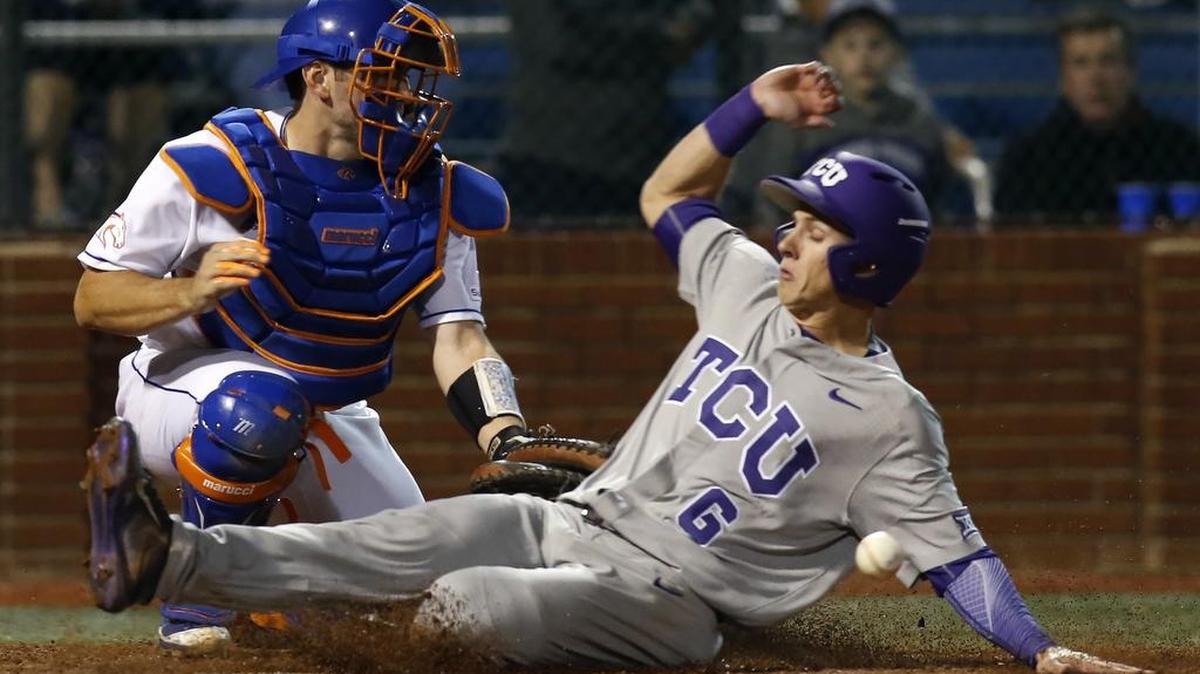 TCU base runner Nolan Brown scores just ahead of the tag by UT Arlington catcher Brady Cox of Fort Worth Arlington Heights during the teams’ game Feb. 21 in Arlington. The Horned Frogs and Mavericks meet again at 6:30 p.m. Tuesday at Clay Gould Ballpark.