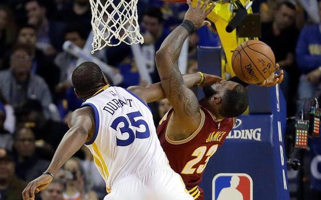 Golden State Warriors forward Kevin Durant blocks the shot of Cleveland Cavaliers forward LeBron James, right, during the second half of an NBA basketball game Monday, Jan. 16, 2017, in Oakland, Calif. Durant and the Warriors, who hammered the Cavaliers 126-91 on Monday, will play host to Russell Westbrook and the Oklahoma City Thunder at 9:30 p.m. Wednesday on ESPN.