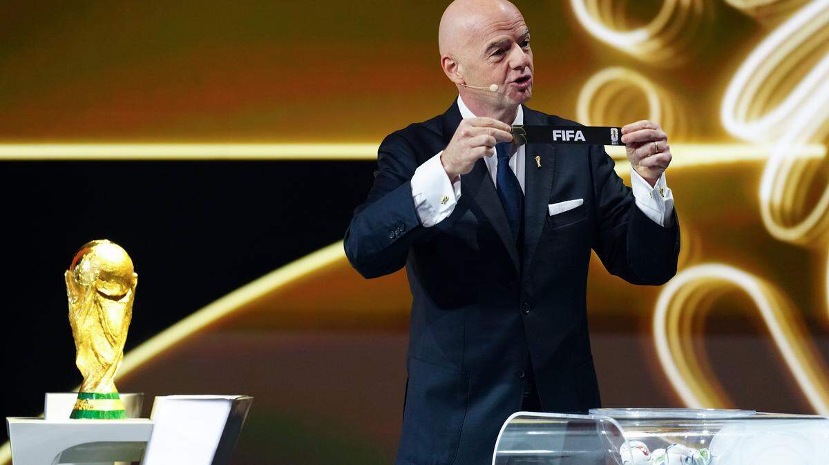 WASHINGTON, DC - DECEMBER 05: Gianni Infantino, President of FIFA, draws out the card of FIFA during the FIFA World Cup 2026 Official Draw at John F. Kennedy Center for the Performing Arts on December 05, 2025 in Washington, DC.