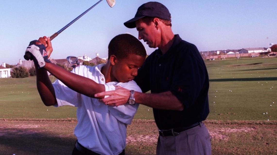 Lindy Miller instructs Arrington Norwood, 15 of Fort Worth, on his golf stroke at Mira Vista Golf Club in 1998. (Star-Telegram/Alison Woodworth)
