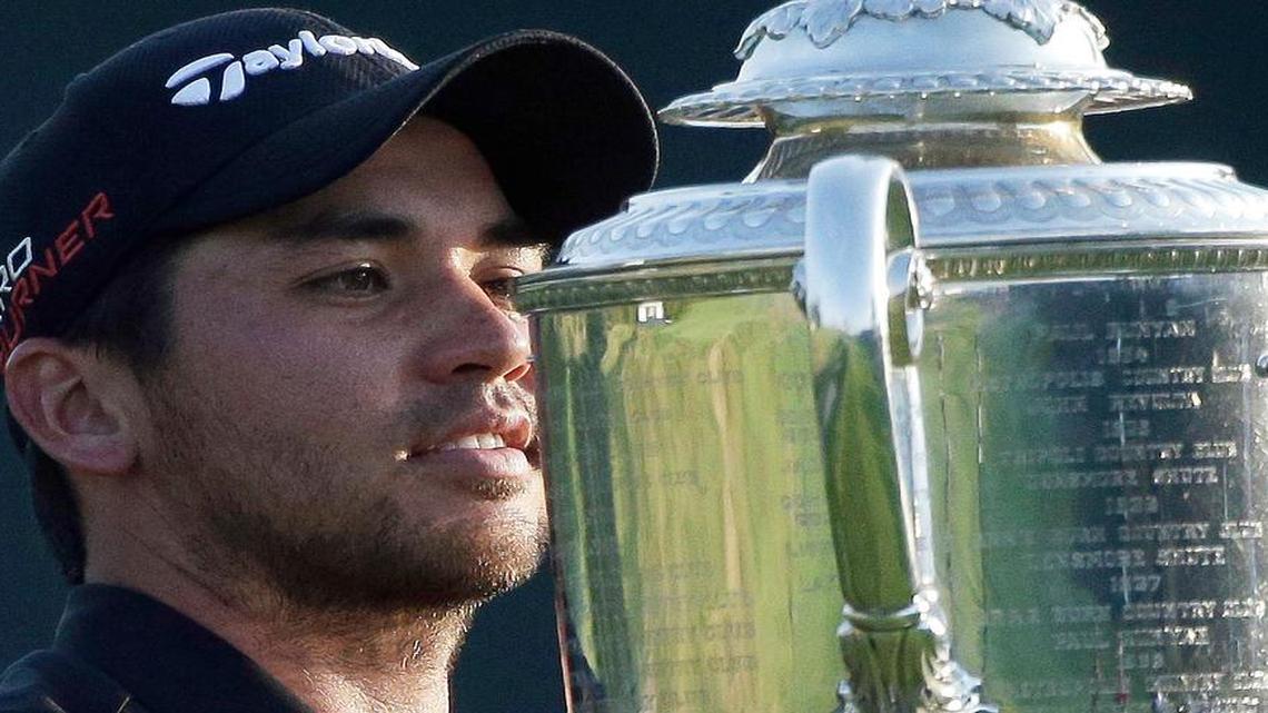 
Jason Day, of Australia, holds up the Wanamaker Trophy after winning the PGA Championship golf tournament Sunday, Aug. 16, 2015, at Whistling Straits in Haven, Wis. 
