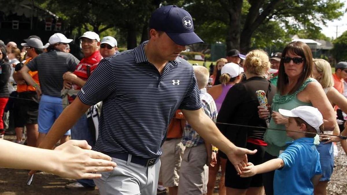 
Jordan Spieth acknowledges fans as he approaches the tee box at 18 at the Crowne Plaza Invitational at Colonial Sunday, May 24, 2015. 
