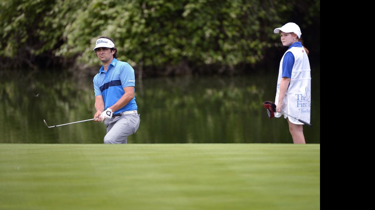 
Martin Flores, under the watchful eye of First Tee caddie Marget Lewis, says his game has matured. Flores will be making his third start at Colonial on Thursday.
