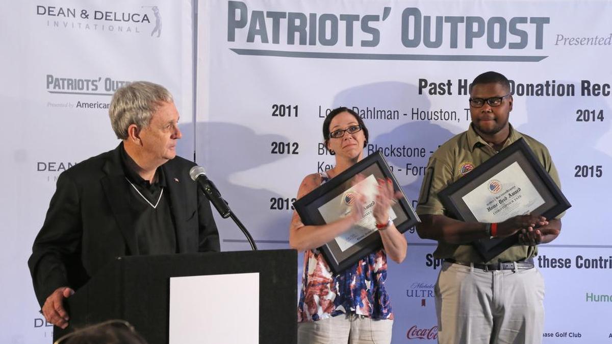Lt. Gen. Leroy Sisco (U.S. Army, retired) announces that widow Brandy Oakes and Purple Heart recipient Christopher Tate are each awarded new homes by the Military Warriors Support Foundation in a ceremony on the 17th hole during the Dean & DeLuca Invitational at Colonial Country Club Saturday.
