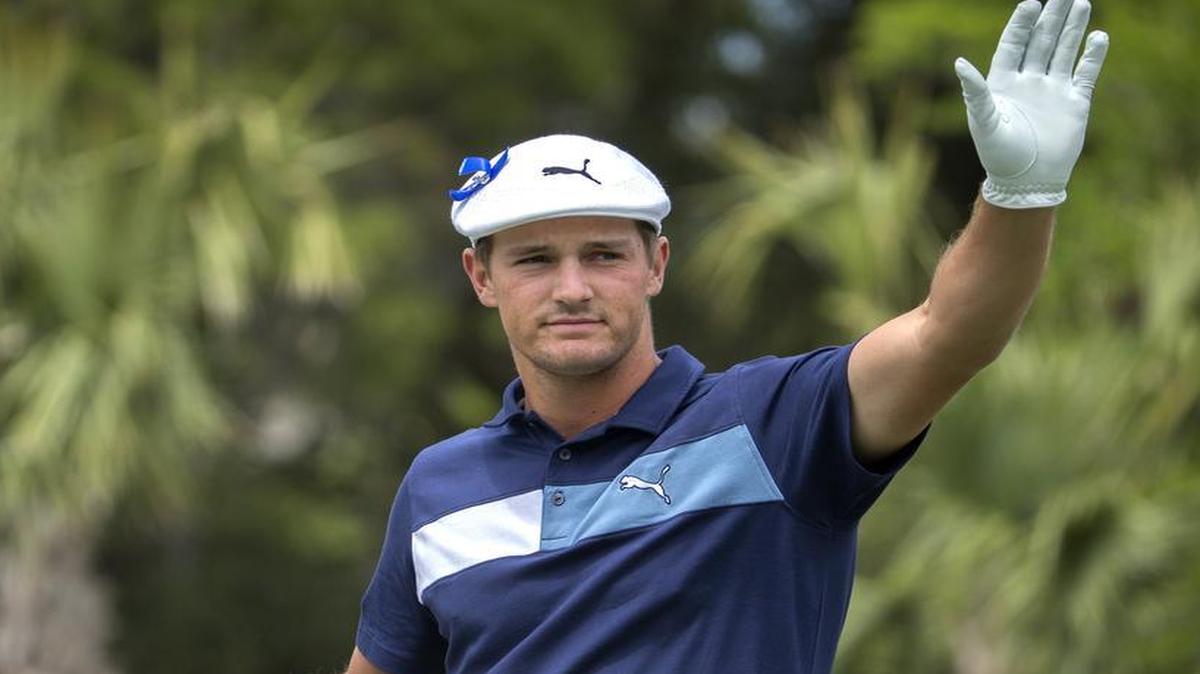 Bryson DeChambeau, committed to play in the Dean & DeLuca Invitational in Fort Worth in late May, waves to the crowd after being introduced on the first tee at the RBC Heritage golf tournament in Hilton Head Island, S.C..