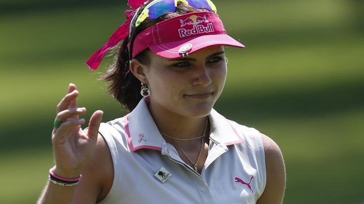 
Lexi Thompson of Florida waves to the gallery on the ninth green during the Volunteers of America North Texas Shootout on Saturday. She shot 68 Saturday and is the co-leader at 9-under 204 through 54 holes. 

