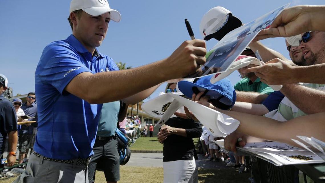 Jordan Spieth, seen here signing autographs at the Cadillac Championship golf tournament in March, doesn’t have much use for professional autograph dealers, calling them “scums” after a practice round at Pebble Beach.
