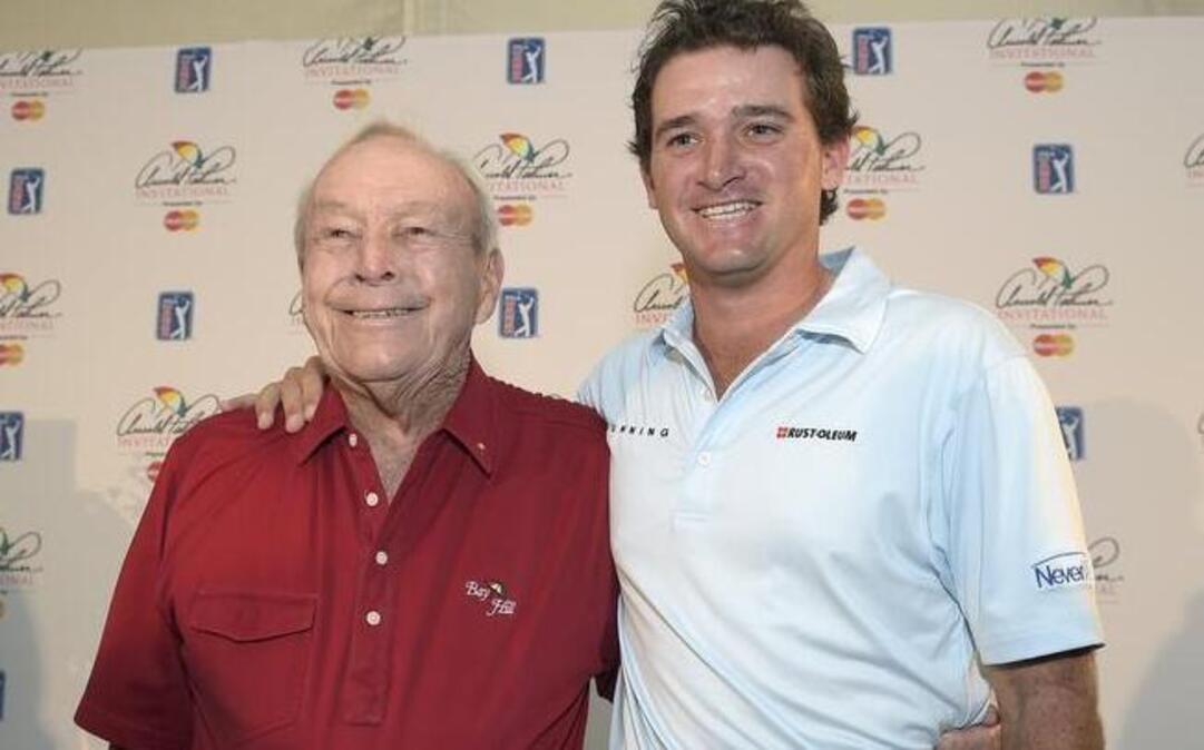 
Arnold Palmer, left, stands next to his grandson Sam Saunders at the Arnold Palmer Invitational golf tournament in Orlando, Fla., in March.
