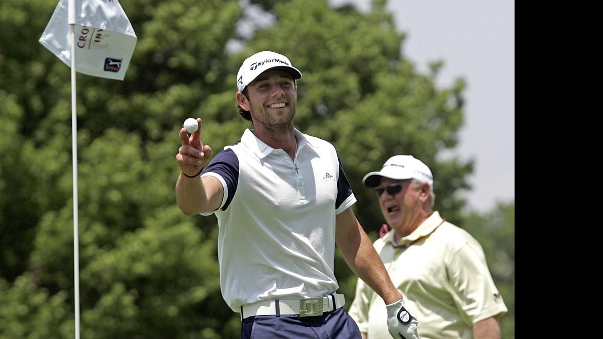 
Franklin Corpening is all smiles after retrieving his eagle from the cup on the sixth hole during the Hogan Pro-Am at the Colonial Country Club in 2013.

