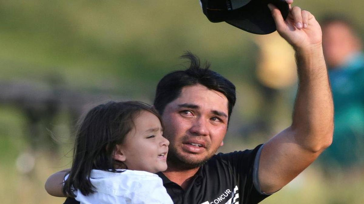 
Jason Day, of Australia, holds his son Dash as he walks off the 18th green after winning the PGA Championship golf tournament Sunday, Aug. 16, 2015, at Whistling Straits in Haven, Wis. 
