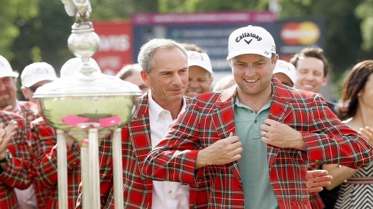 
Chris Kirk is presented with a plaid jacket after his win at the Crowne Plaza Invitational at Colonial in Fort Worth on Sunday, May 23, 2015. 
