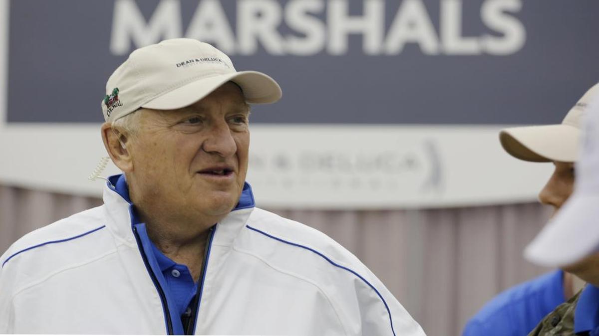 Fort Worth city councilman Dennis Shingleton passes time with 500 other volunteers during a morning rain delay at the Dean & DeLuca Invitational.