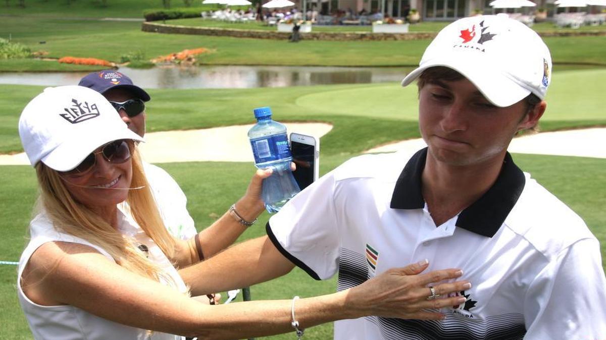 
Austin Connelly, right, of Irving, gets a pat on the chest from his mother, Bridget, on Thursday at the AT&T Byron Nelson in Irving. Connelly, 18, shot a 1-under-par 69 in fulfilling a dream to play in the Nelson as an amateur.

