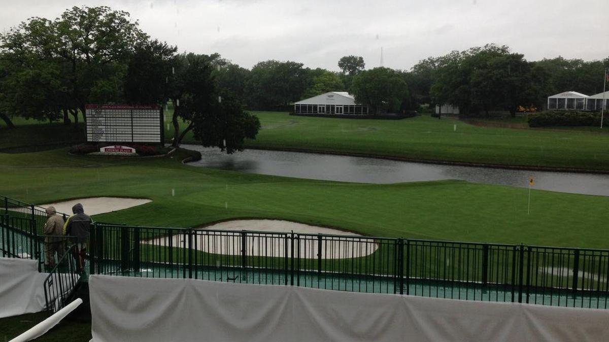 
Cleanup work continues by the 18th hole at Colonial. The course has taken on six inches of rain in the past 10 days.

