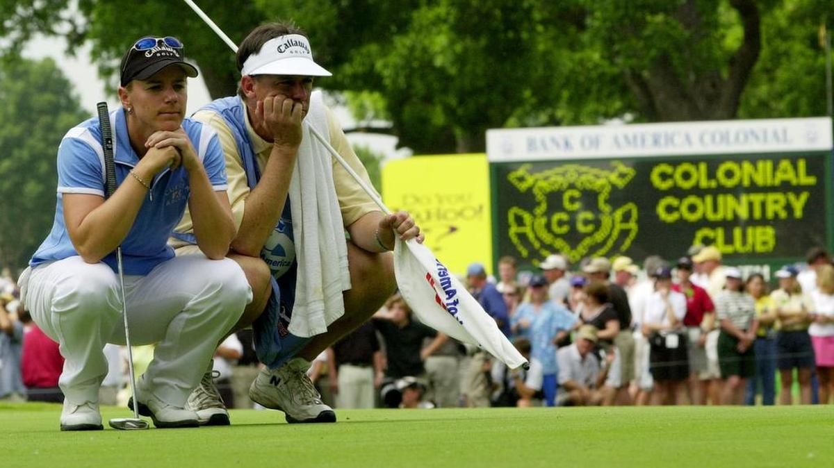 Golfer Annika Sorenstam and her caddie, Terry McNamara, wear long faces as they wait for Sorenstam’s turn to putt on the 10th hole during the second round at Colonial in 2003. Sorenstam didn’t make the cut.