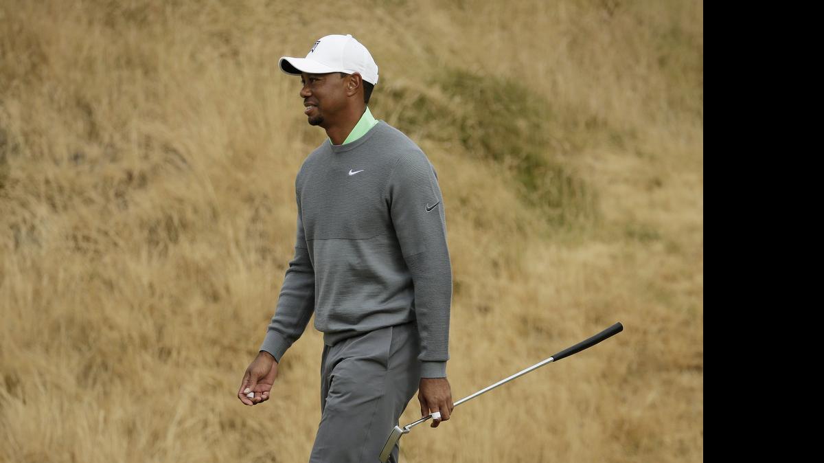 
Tiger Woods walks to the sixth green during a practice round for the U.S. Open golf tournament at Chambers Bay on Tuesday, June 16, 2015 in University Place, Wash. 
