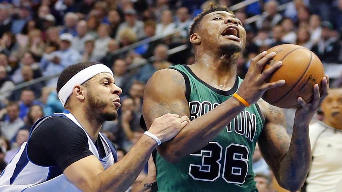 Guard Marcus Smart, right, and the Boston Celtics handled Seth Curry and the Dallas Mavericks on Monday in a 111-98 victory. The Celtics travel to Chicago on Thursday to take on the Bulls in the final NBA game before the All-Star break. TNT has the coverage starting at 7 p.m.