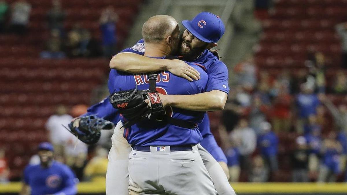 Cubs pitcher Jake Arrieta, right, embraces catcher David Ross after throwing a no-hitter in a 16-0 victory over Cincinnati on Thursday. Arrieta has thrown two no-hitters in his last 11 starts since Aug. 30.