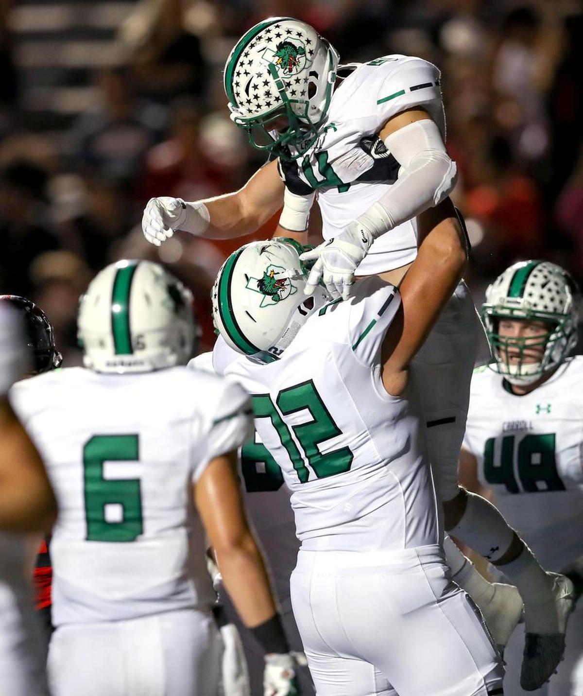Southlake Carroll running back TJ McDaniel (4) celebrates with Jackson Kimble (72) after McDaniel’s touchdown run against Trinity, during the first half Friday night, October 6, 2017 played at Pennington Field in Bedford.