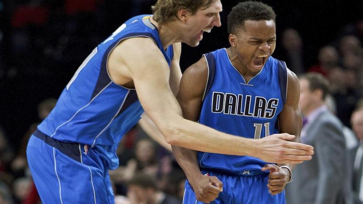 Yogi Ferrell, right, scored 32 points Friday to lead Dirk Nowitzki and the Mavericks to a 108-104 victory over Portland in Dallas’ fourth straight win. The Mavs shoot for five Monday in Denver against the Nuggets. The game will be televised at 8 p.m. on Fox Sports Southwest.