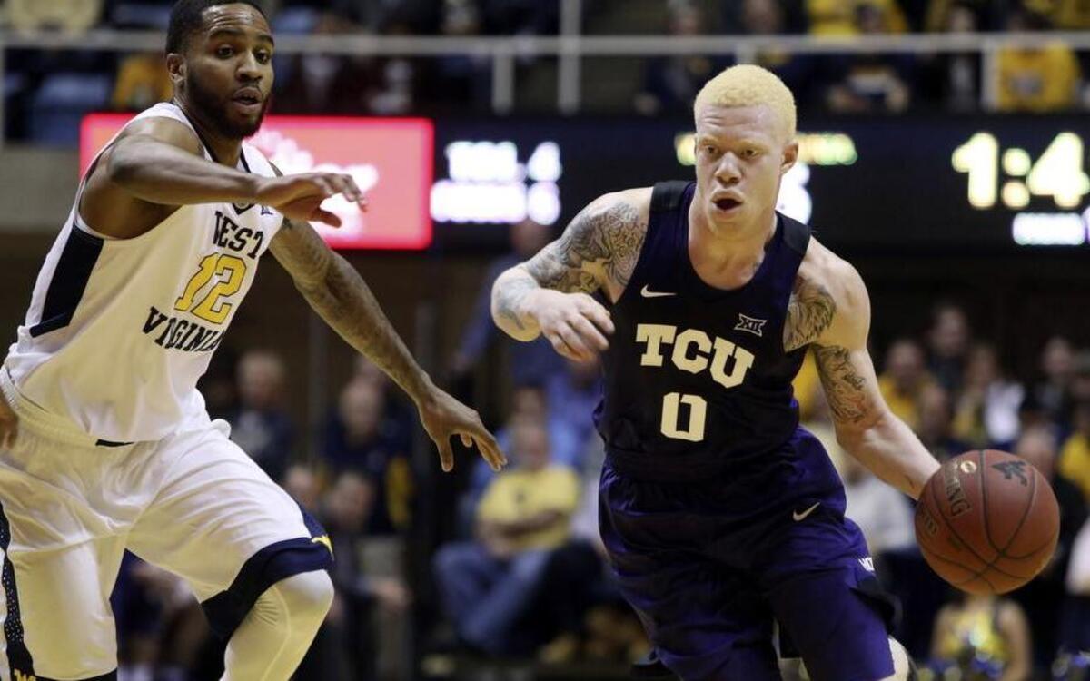 TCU guard Jaylen Fisher, right, driving during Saturday’s loss to Tarik Phillip and West Virginia, and the Horned Frogs take on Texas on Wednesday in Austin. The game will be televised on Longhorn Network at 7 p.m.