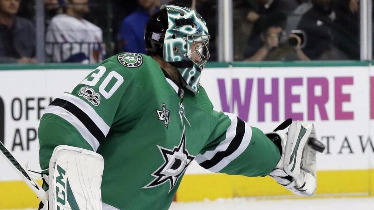 Dallas Stars goalie Ben Bishop gloves a shot from the New York Islanders in the second period of Friday night’s shutout victory.