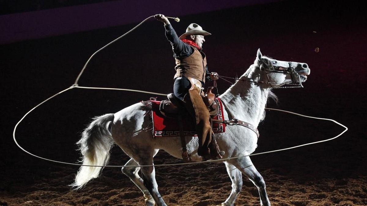 Trick roper Jerry Diaz of San Antonio performs a tribute to Will Rogers during the World’s Original Indoor Rodeo at the Fort Worth Stock Show and Rodeo on Saturday, Jan. 26, 2013. This year’s version of the event begins at 7:30 p.m. Friday at Will Rogers Memorial Coliseum.