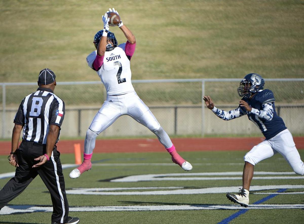 South Hills Scorpions receiver Tylan Wallace (2) scores a first quarter touchdown in front of YMLA’s Deuante Hartin.