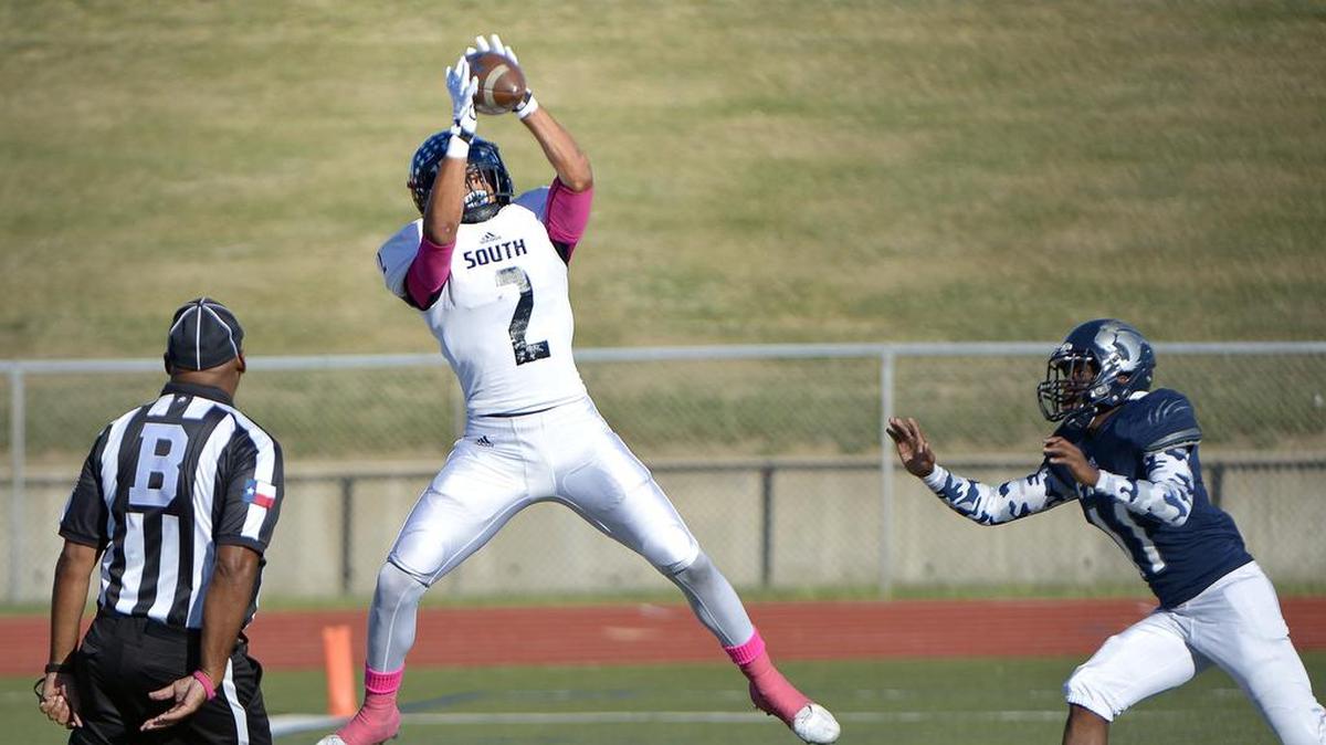 South Hills Scorpions receiver Tylan Wallace (2) scores a first quarter touchdown in front of YMLA’s Deuante Hartin.
