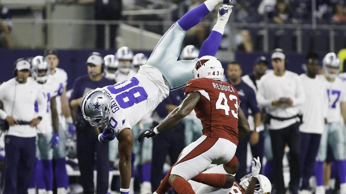Dallas Cowboys tight end Rico Gathers (80) is upended by Arizona Cardinals cornerback Deatrick Nichols (39) during the second half of a preseason NFL football game on Sunday, August 26, 2018 at AT&T Stadium in Arlington, Texas. (Special to the Star-Telegram/Ray Carlin)