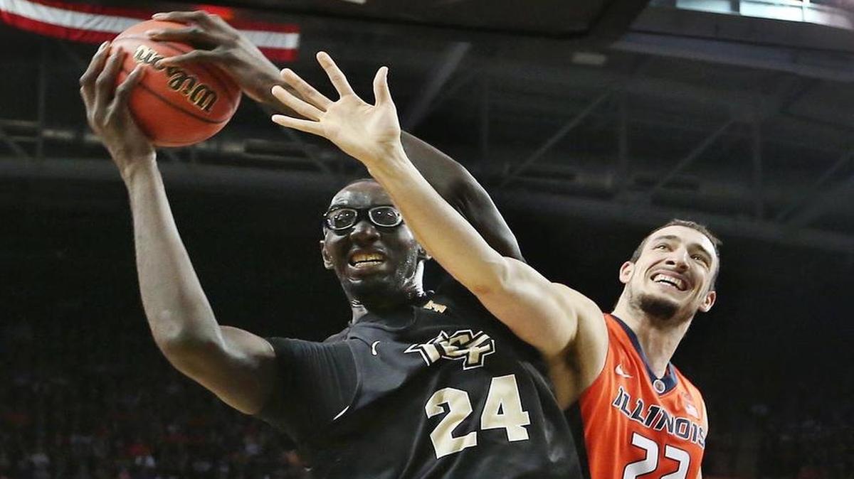 UCF center Tacko Fall, left, who is 7-foot-6, and the Knight present a tall challenge for TCU on Tuesday in the NIT semifinals at Madison Square Garden. The telecast begins at 8:30 p.m. on ESPN.