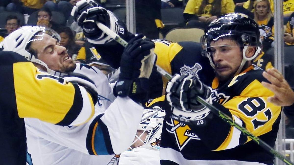 The Sharks and Penguins tangle in Game 6 at 7 p.m. Sunday in the NHL Stanley Cup final on NBC (KXAS/Channel 5). On Thursday night, San Jose’s Marc-Edouard Vlasic, left, and Pittsburgh’s Sidney Crosby (87) joust during the third period of the Sharks 4-2 victory that forced Sunday’s Game 6 in San Jose.