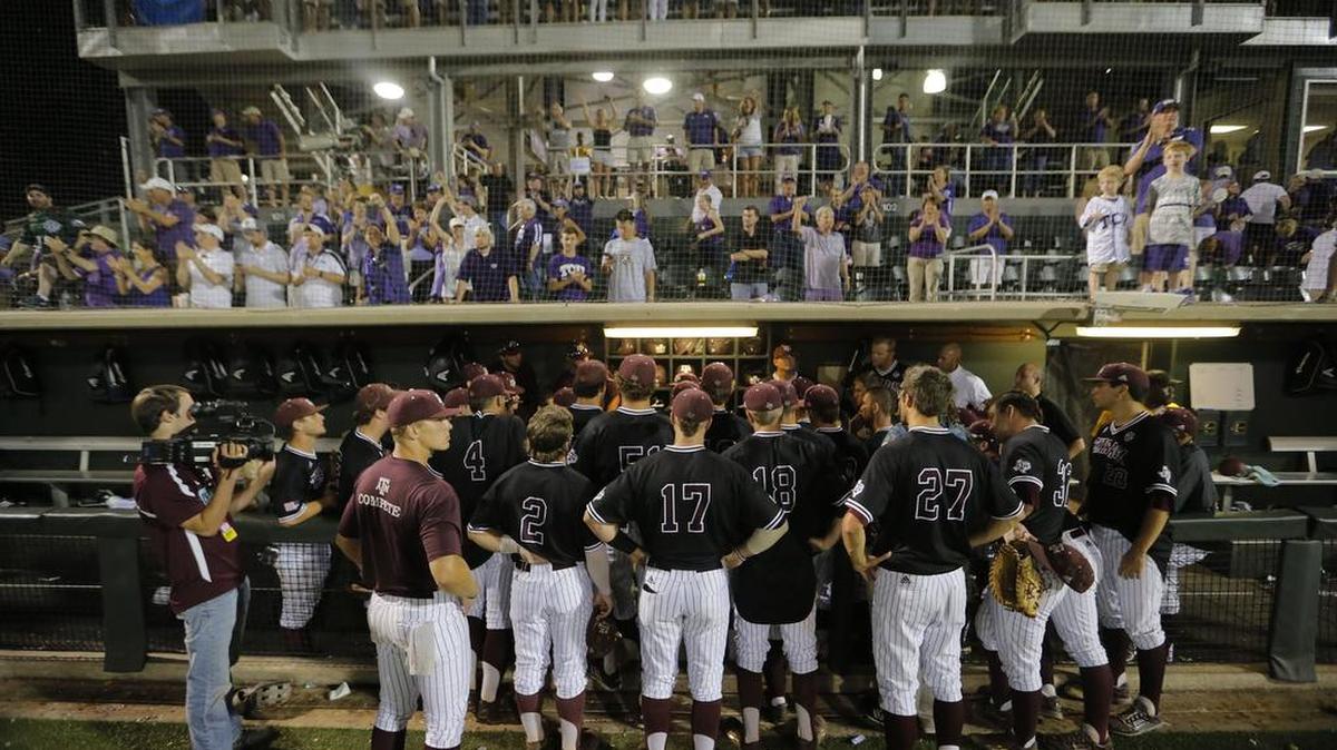 The Aggies meet by the dugout after TCU defeated them 5-4 in 16 innings in a Super Regional in 2015.