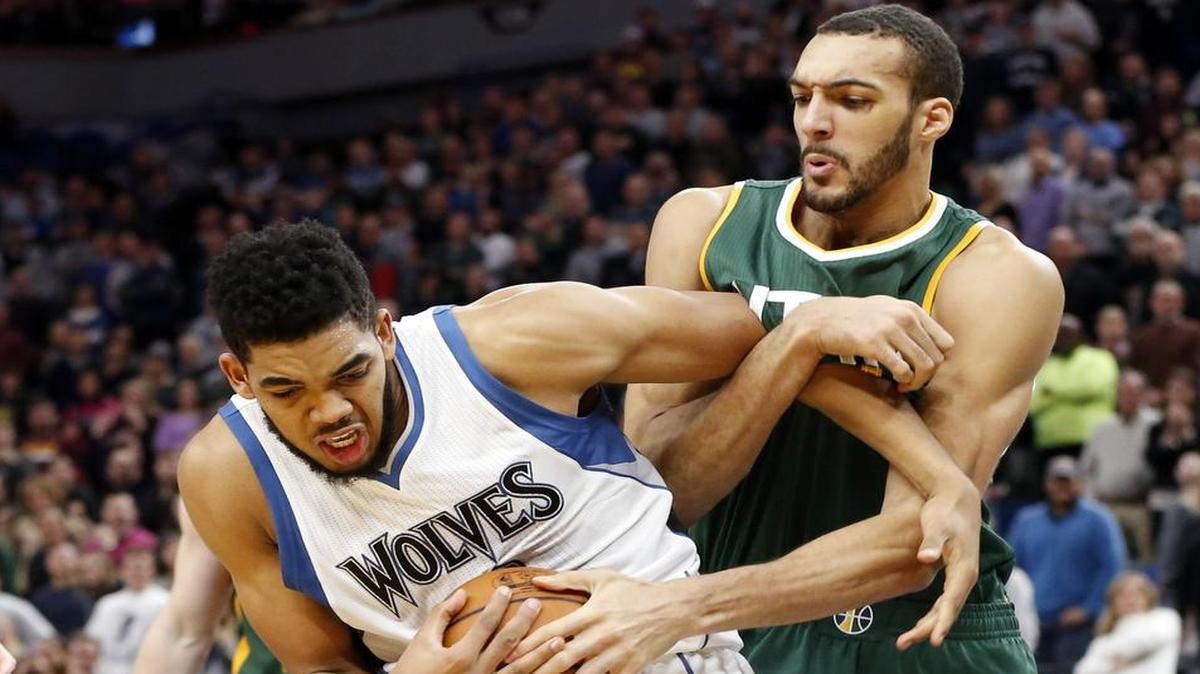 Karl-Anthony Towns, left, battling Utah’s Rudy Gobert for the ball in Saturday’s game, and the Minnesota Timberwolves play host to the Dallas Mavericks on Monday in a matchup of teams tied for last in the Western Conference at 11-26. Towns is averaging a double-double with 21.4 points and 11.6 rebounds a game. Monday’s game will be televised at 7 p.m. on Fox Sports Southwest.