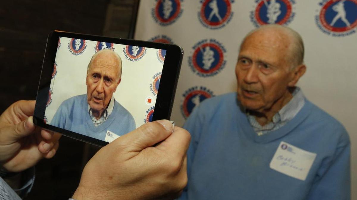 Dr. Bobby Brown, a member of the advisory committee, talks about his career at the Bobby Bragan Collegiate Slugger Award reception Wednesday in Fort Worth.