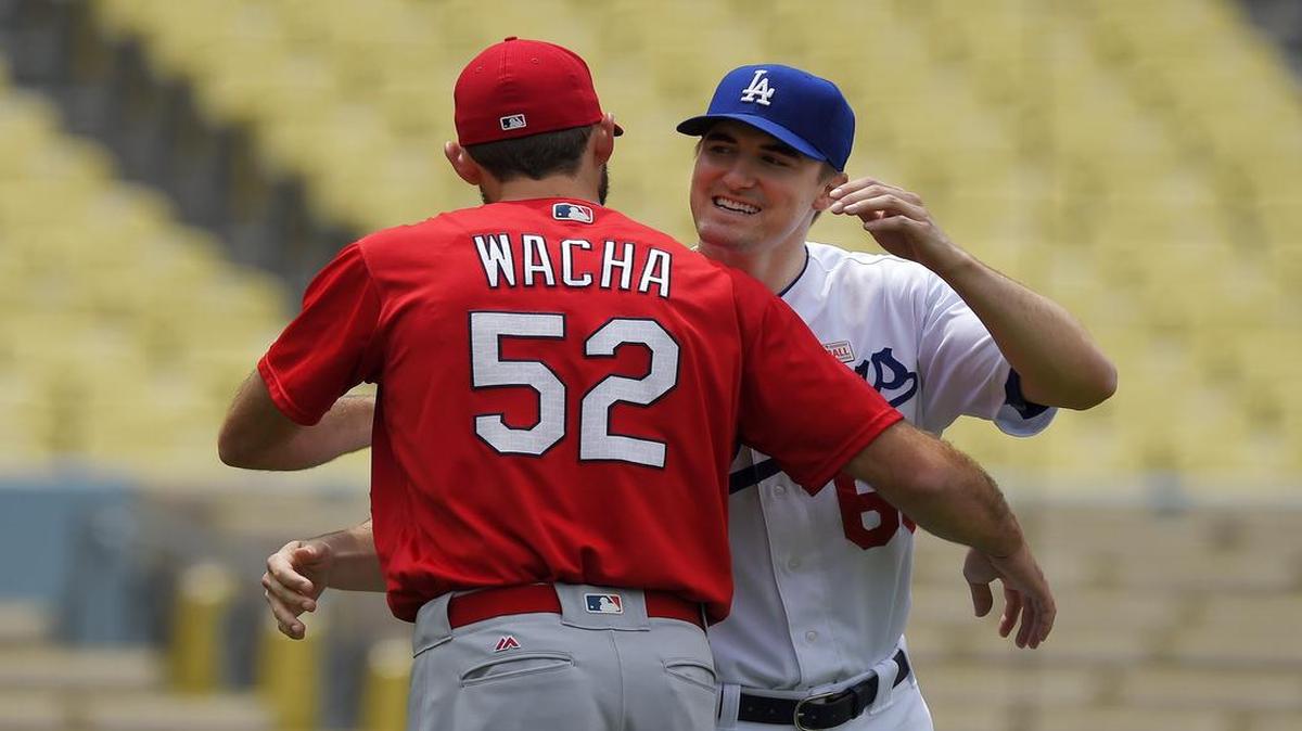 Cardinals pitcher Michael Wacha, left, hugs Dodgers pitcher and Southlake Carroll alumnus Ross Stripling before the two faced off on May 13. They were roommates while playing at Texas A&M.